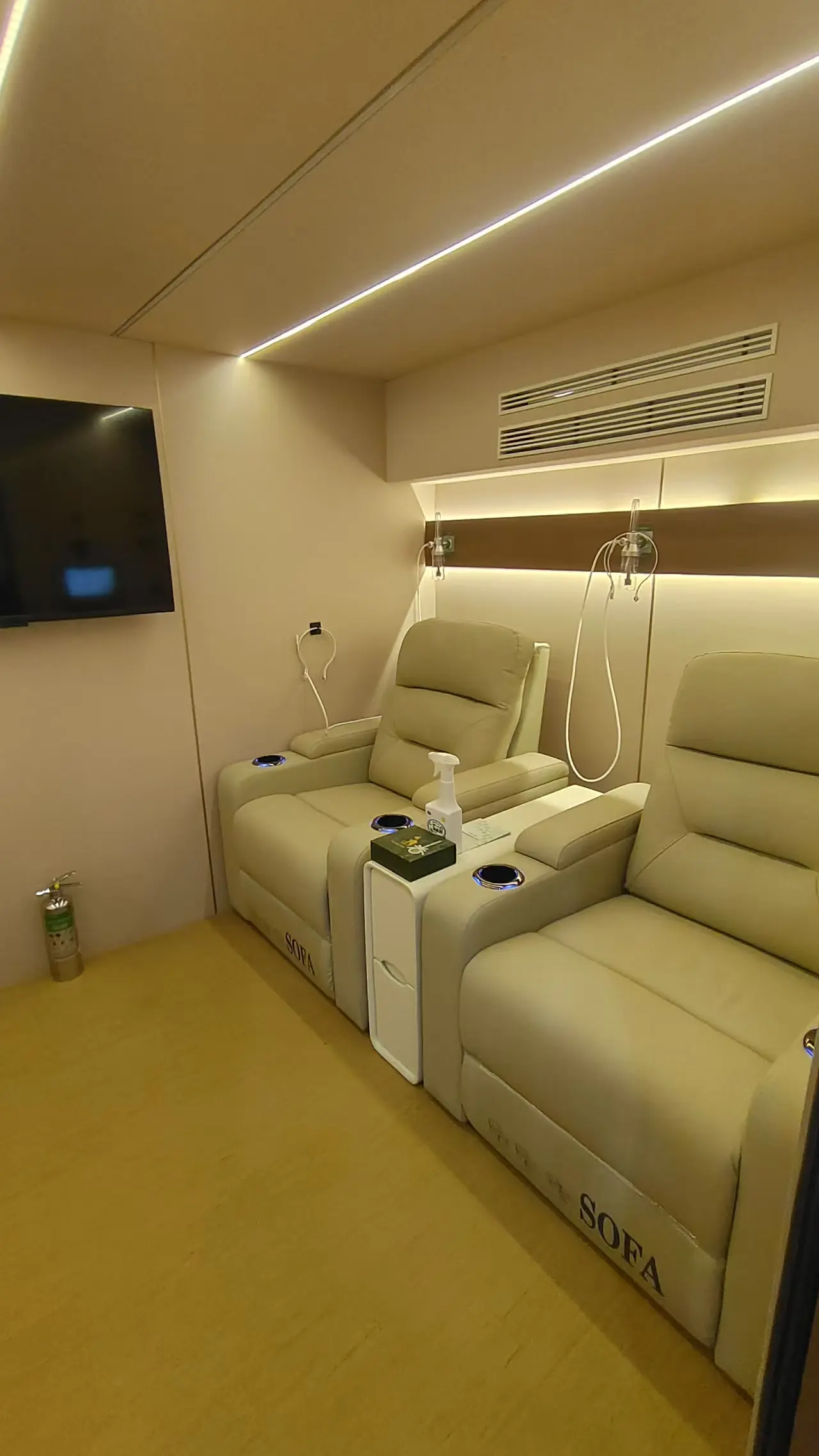 Interior of the Ueerl H8 four-person hyperbaric chamber with reclining seats and warm lighting